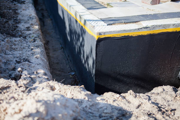 Professional Waterproofing technician working in Palmyra, MI